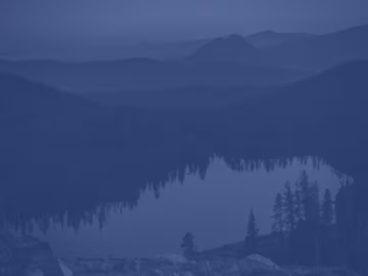 Mountain lake and forest in Northern California at dusk.