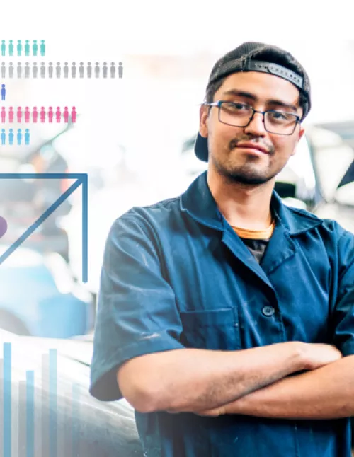 Person wearing glasses and a backwards cap with his arms crossed and a slight smile. There are icons of people and charts to the left of the image.