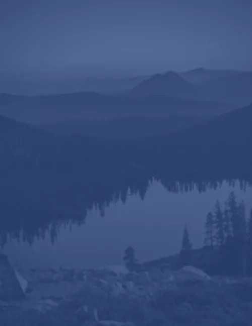 Mountain lake and forest in Northern California at dusk.